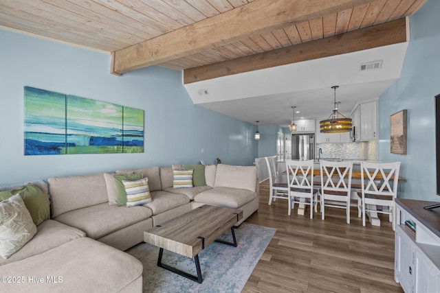 535 Salter Path Rd Unit 3, Pine Knoll Shores, NC 28512 - living area with wood finished floors and wooden ceiling with exposed beams