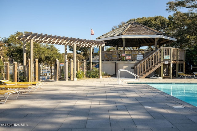 535 Salter Path Rd Unit 3, Pine Knoll Shores, NC 28512 - community pool featuring a pergola, a gazebo, stairs, and a patio area