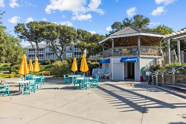 535 Salter Path Rd Unit 3, Pine Knoll Shores, NC 28512 - view of patio / terrace with outdoor dining space and a pergola