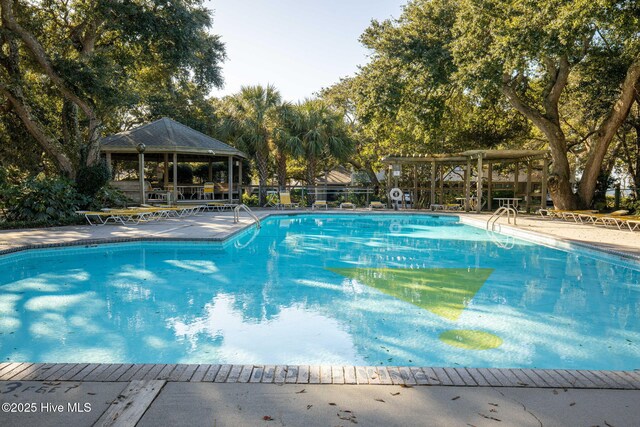 535 Salter Path Rd Unit 3, Pine Knoll Shores, NC 28512 - community pool featuring a gazebo and view of wooded area