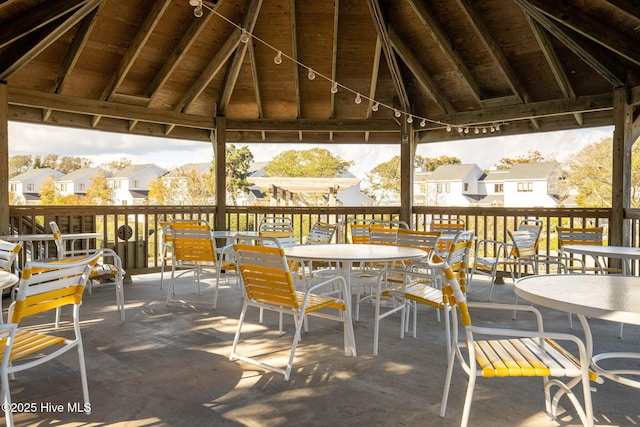 535 Salter Path Rd Unit 3, Pine Knoll Shores, NC 28512 - deck featuring a gazebo, a residential view, and outdoor dining area
