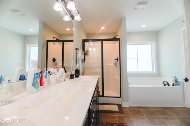 103 Stafford Dr, Pikeville, NC 27863 - full bathroom featuring a garden tub, double vanity, a stall shower, and recessed lighting