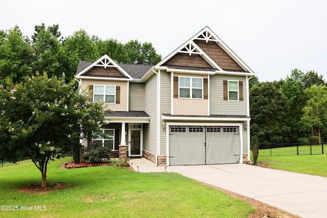103 Stafford Dr, Pikeville, NC 27863 - craftsman house featuring driveway, an attached garage, stone siding, and roof with shingles