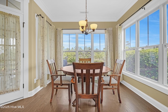 4277 Kingston Ct, Southport, NC 28461 - sunroom / solarium with plenty of natural light and a chandelier