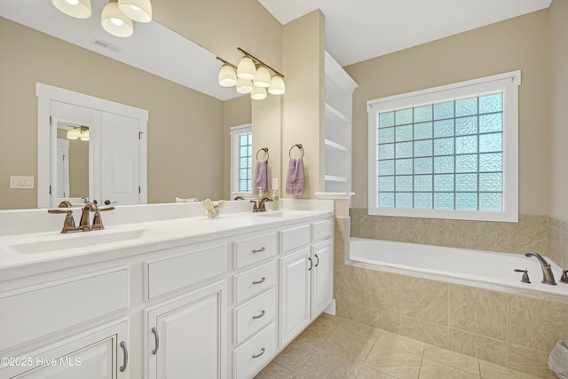 4277 Kingston Ct, Southport, NC 28461 - bathroom featuring double vanity, a bath, and tile patterned flooring