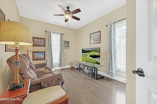 4277 Kingston Ct, Southport, NC 28461 - living room with ceiling fan, wood finished floors, and baseboards
