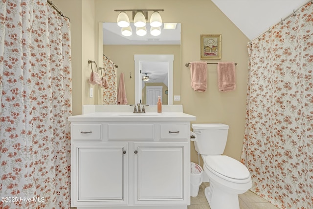 4277 Kingston Ct, Southport, NC 28461 - bathroom featuring vanity, toilet, tile patterned flooring, curtained shower, and lofted ceiling