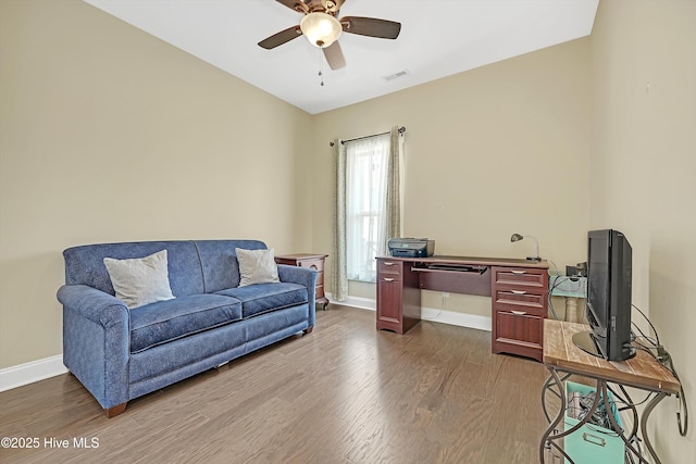 4277 Kingston Ct, Southport, NC 28461 - living area with ceiling fan, wood finished floors, and baseboards