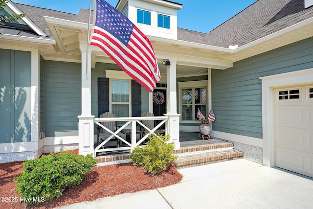 4277 Kingston Ct, Southport, NC 28461 - doorway to property with covered porch, roof with shingles, and a garage