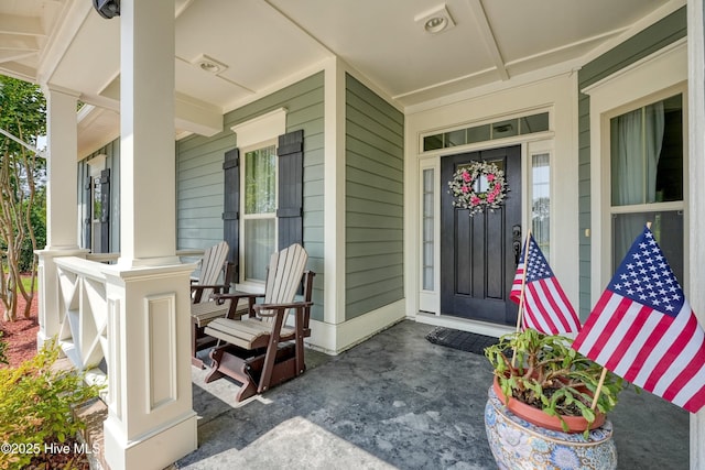 4277 Kingston Ct, Southport, NC 28461 - doorway to property with a porch