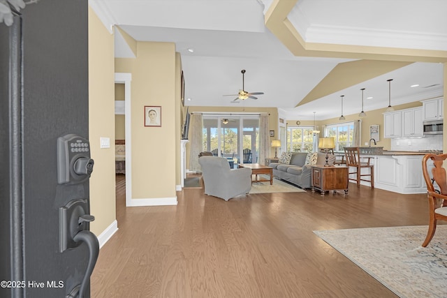 4277 Kingston Ct, Southport, NC 28461 - living room with a ceiling fan, crown molding, wood finished floors, vaulted ceiling, and recessed lighting