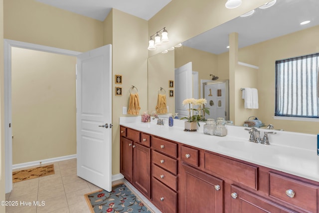 5170 Swashbuckler Way, Southport, NC 28461 - bathroom featuring double vanity, a stall shower, tile patterned flooring, and baseboards