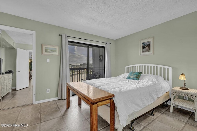 404 S Carolina Beach Ave Unit B7, Carolina Beach, NC 28428 - bedroom featuring access to outside and a textured ceiling