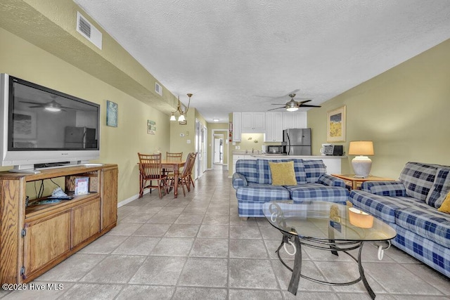 404 S Carolina Beach Ave Unit B7, Carolina Beach, NC 28428 - living room featuring a ceiling fan and a textured ceiling
