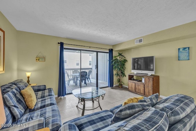 404 S Carolina Beach Ave Unit B7, Carolina Beach, NC 28428 - living area with light tile patterned floors and a textured ceiling