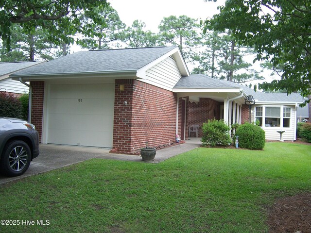 125 Pinehurst Trace Dr, Pinehurst, NC 28374 - view of home's exterior with brick siding, concrete driveway, and a garage