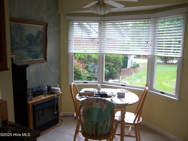125 Pinehurst Trace Dr, Pinehurst, NC 28374 - dining room with light tile patterned flooring, ceiling fan, and baseboards
