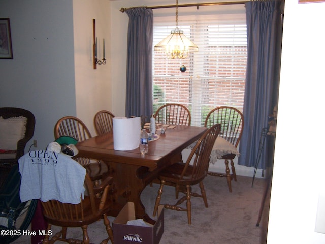 125 Pinehurst Trace Dr, Pinehurst, NC 28374 - dining room featuring a chandelier and carpet flooring