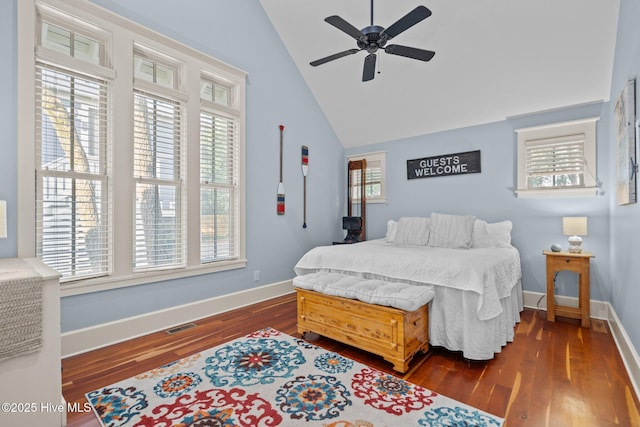 401 Fire Fly Ln, Southport, NC 28461 - bedroom featuring vaulted ceiling, dark wood-style floors, baseboards, and a ceiling fan