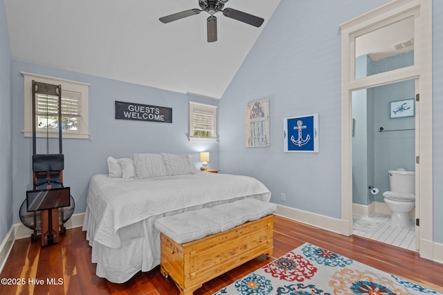 401 Fire Fly Ln, Southport, NC 28461 - bedroom featuring vaulted ceiling, wood finished floors, multiple windows, and baseboards