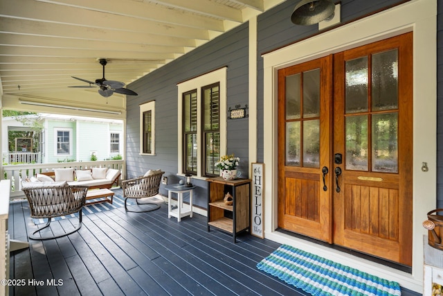 401 Fire Fly Ln, Southport, NC 28461 - porch featuring french doors, a ceiling fan, and an outdoor living space