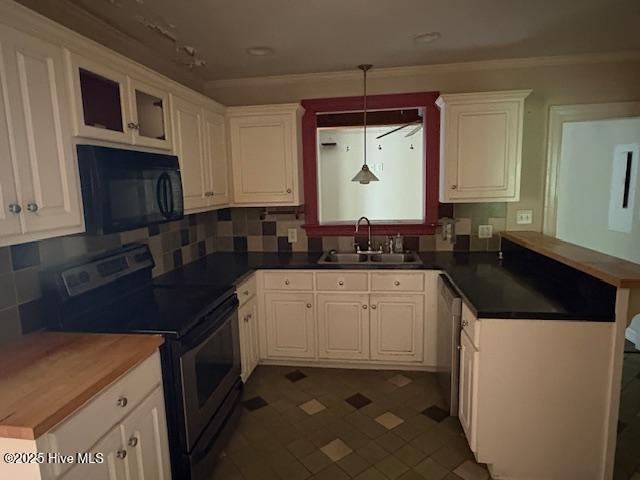 1041 Lafayette Ave, Rocky Mount, NC 27803 - kitchen featuring appliances with stainless steel finishes, a sink, a peninsula, white cabinetry, and ornamental molding