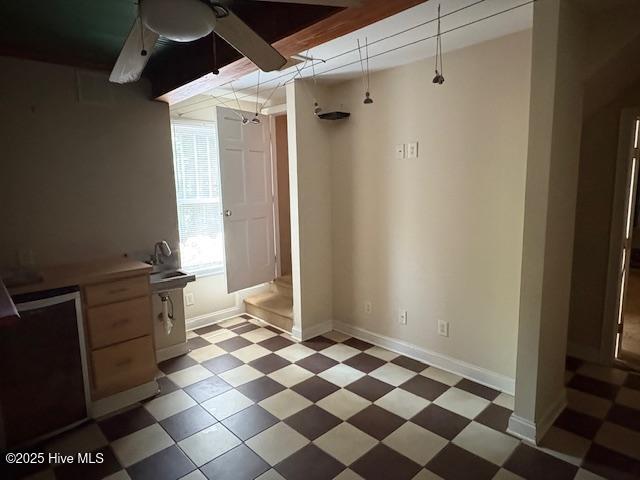 1041 Lafayette Ave, Rocky Mount, NC 27803 - basement with light floors, ceiling fan, and baseboards