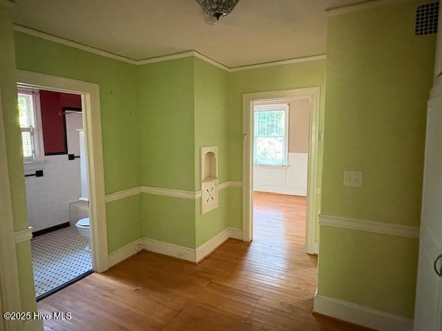 1041 Lafayette Ave, Rocky Mount, NC 27803 - hallway featuring wood finished floors, baseboards, and crown molding