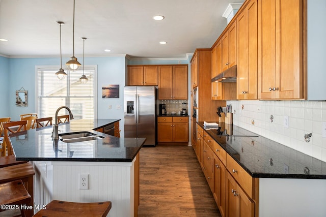kitchen featuring black appliances, dark wood-style floors, crown molding, brown cabinetry, and decorative backsplash
