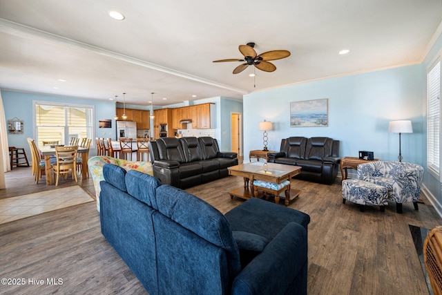 living room featuring recessed lighting, a ceiling fan, plenty of natural light, wood finished floors, and crown molding