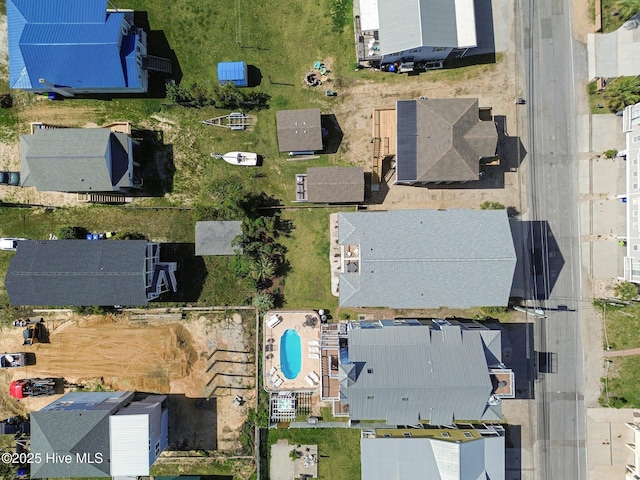 aerial view of property and surrounding area featuring a pool area