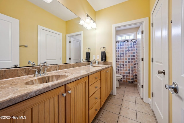 bathroom with double vanity, tile patterned floors, and a shower with shower curtain