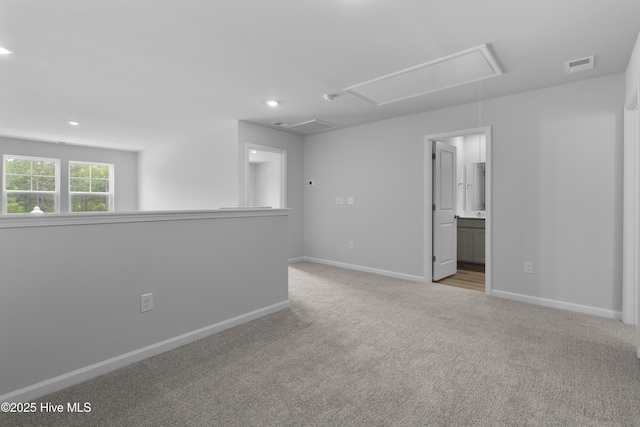 796 Palm Frond Way Unit 47, Calabash, NC 28467 - spare room with attic access, light colored carpet, recessed lighting, and baseboards