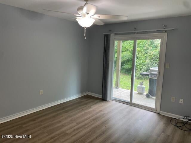 3309 Bridges St Unit 12, Morehead City, NC 28557 - unfurnished room with wood finished floors, baseboards, and ceiling fan