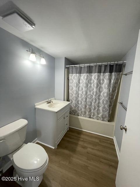3309 Bridges St Unit 12, Morehead City, NC 28557 - bathroom with toilet, shower / tub combo, vanity, and wood finished floors
