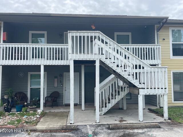 3309 Bridges St Unit 12, Morehead City, NC 28557 - back of property with a patio and stairs