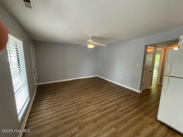 3309 Bridges St Unit 12, Morehead City, NC 28557 - spare room featuring a ceiling fan, healthy amount of natural light, baseboards, and wood finished floors