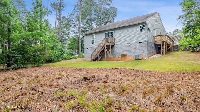 149 Edinburgh Dr, Carthage, NC 28327 - back of house with stairs, a wooden deck, central AC unit, and a lawn