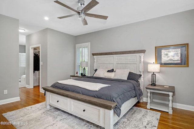 224 Red Fox Run Dr, Wallace, NC 28466 - bedroom with wood finished floors, baseboards, a spacious closet, and ceiling fan
