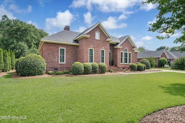 224 Red Fox Run Dr, Wallace, NC 28466 - view of front facade featuring crawl space, brick siding, a chimney, and a front yard