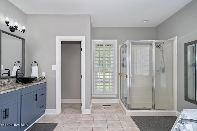 224 Red Fox Run Dr, Wallace, NC 28466 - bathroom featuring vanity, a stall shower, tile patterned floors, baseboards, and a tub to relax in