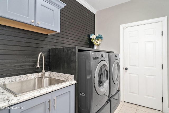 224 Red Fox Run Dr, Wallace, NC 28466 - laundry area featuring washer and clothes dryer, light tile patterned floors, cabinet space, and wood walls