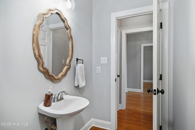 224 Red Fox Run Dr, Wallace, NC 28466 - bathroom featuring baseboards, a sink, and wood finished floors