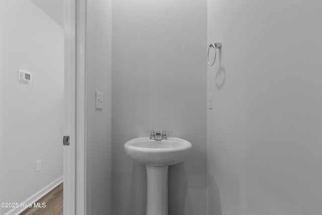 786 Palm Frond Way Unit 51, Calabash, NC 28467 - bathroom with wood finished floors, baseboards, and a sink