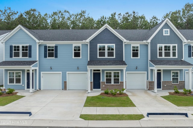 776 Palm Frond Way Unit 55, Calabash, NC 28467 - view of front of home with concrete driveway, an attached garage, brick siding, and a shingled roof