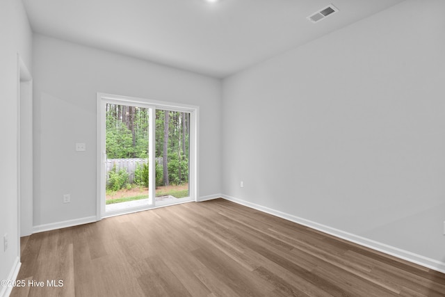 776 Palm Frond Way Unit 55, Calabash, NC 28467 - spare room featuring wood finished floors and baseboards