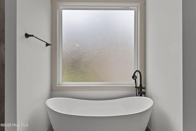 499 Longleaf Dr, West End, NC 27376 - bathroom featuring plenty of natural light and a soaking tub