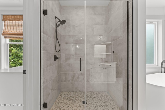 499 Longleaf Dr, West End, NC 27376 - full bathroom featuring a stall shower and a freestanding tub