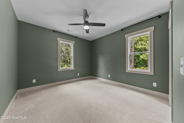 499 Longleaf Dr, West End, NC 27376 - carpeted empty room featuring healthy amount of natural light, ceiling fan, and baseboards