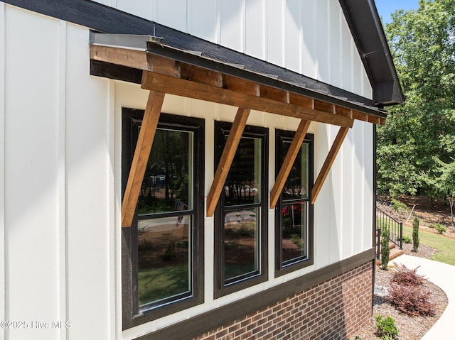 499 Longleaf Dr, West End, NC 27376 - view of home's exterior featuring board and batten siding and brick siding